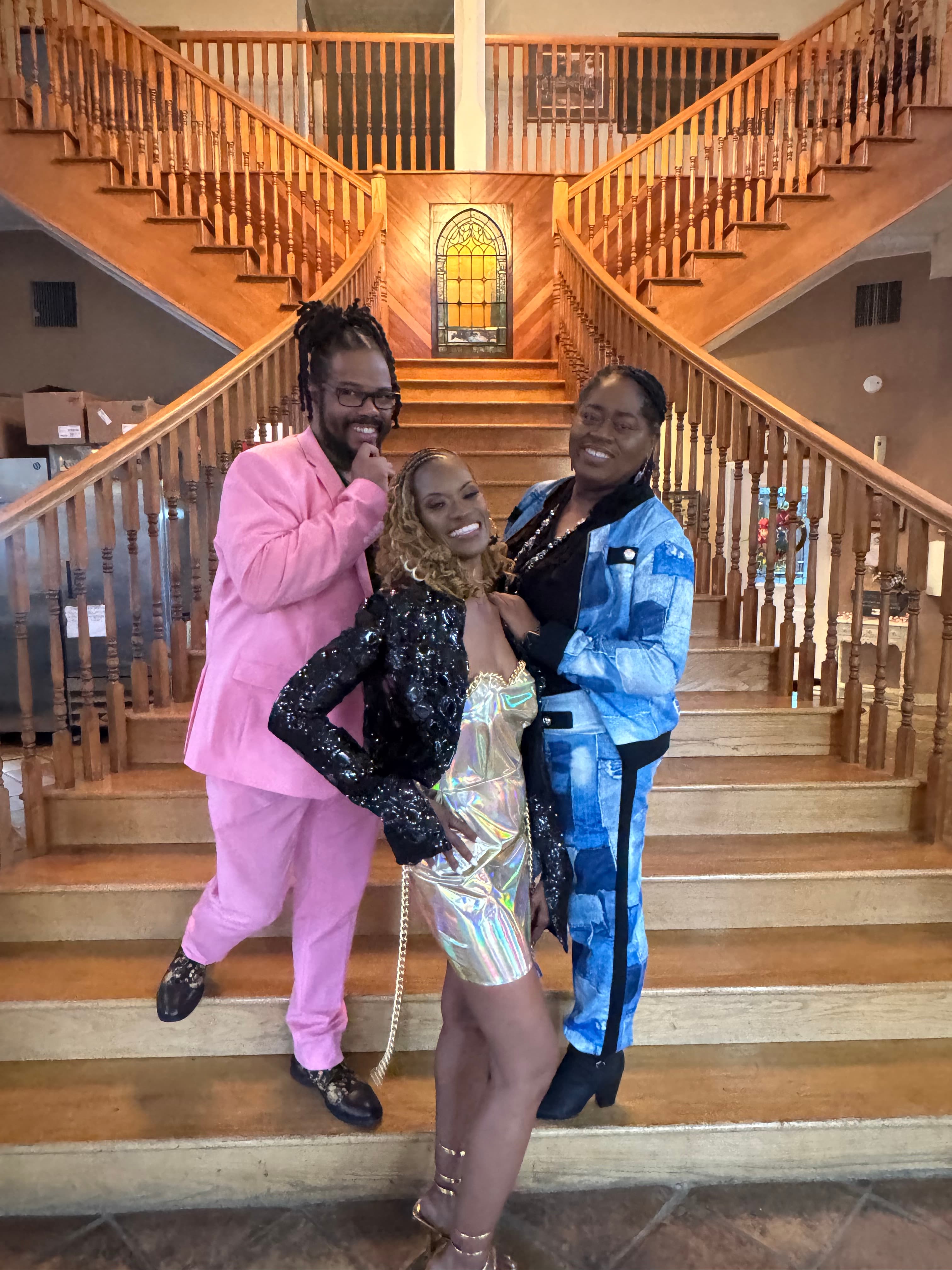 Gregory Rutledge with friends dressed up at a community celebration